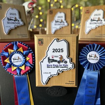 2025 Kora Kare for Kids BBQ competition trophies and ribbons.