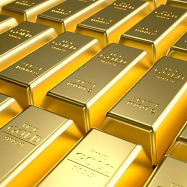 Stacks of shiny gold bars arranged in rows.