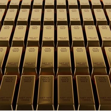 Rows of shiny gold bars labeled with purity and weight.