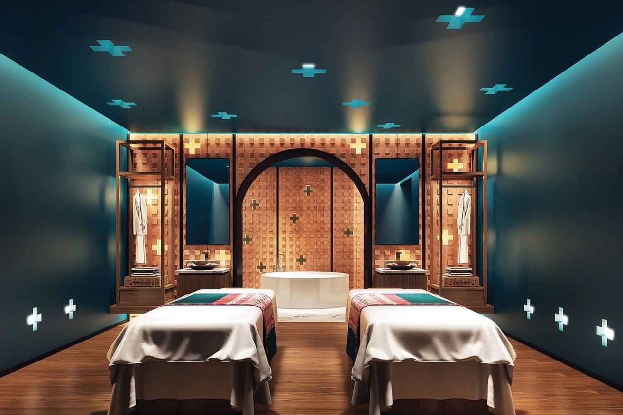 Stack of books next to pencils in a holder and a camera.