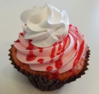 Strawberry cake, topped with a strawberry buttercream frosting
