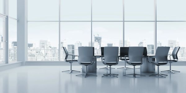 Modern office conference room with city view.