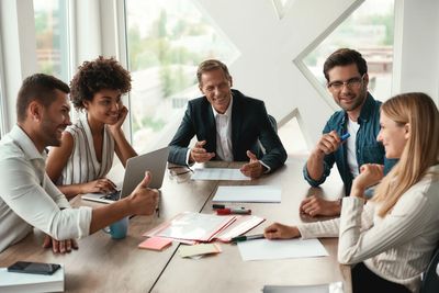 Group of professionals collaborating in a meeting.