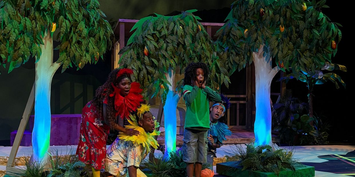 Actors in colorful costumes perform a dramatic scene on a vibrant forest-themed stage.