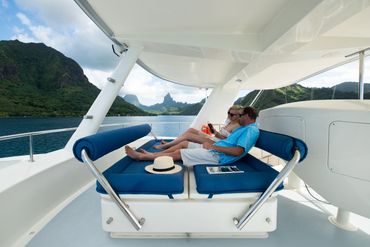 Tahiti sport fishing charter boat ultimate lady guests having a relaxing afternoon
