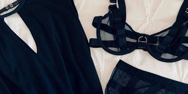 A lingerie flat lay #ootd featuring sheer bra, high-rise thong, belt, LBD.