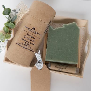 Natural skincare set with eucalyptus shower steamers and peppermint lip balm.
