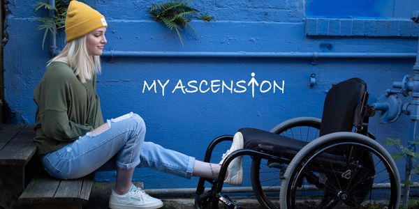 Girl sitting on stair with foot on wheelchair.

Emma Benoit from the documentary; "My Ascension".