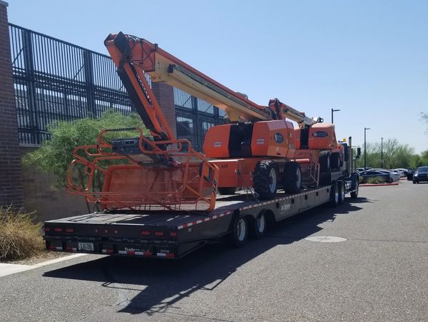 Equipment loaded on a truck flatbed
