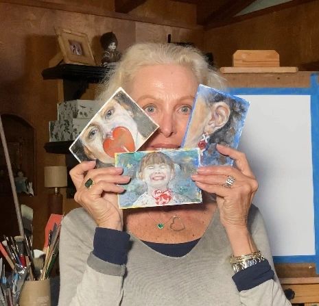 picture of me holding my miniature paintings