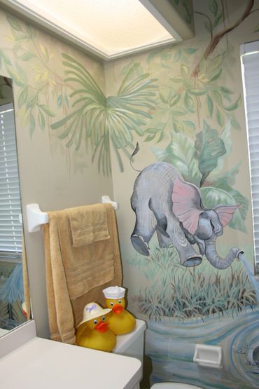 A wall painting of an elephant blowing water 