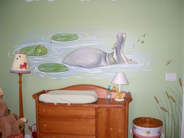 A wall painting of a hippo opening its mouth
