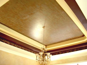Plain simple design for ceiling with a chandelier 