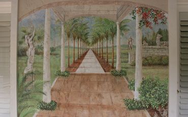 A wall painting of a garden with statues 