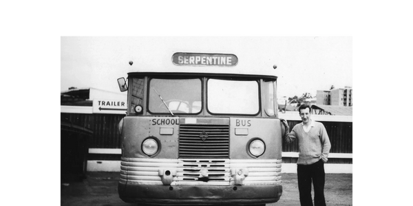 Man standing next to bus