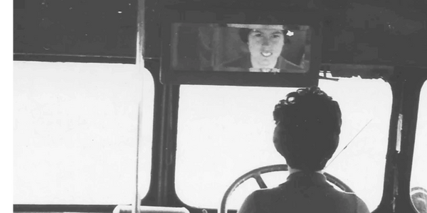 Lady sitting in bus driving seat
