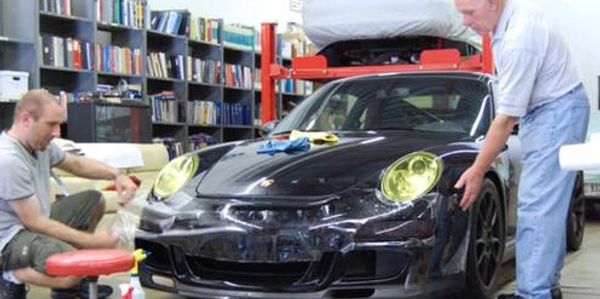 Block A Chip at its early days, applying 3M clear bra to a 2005 Porsche 911.