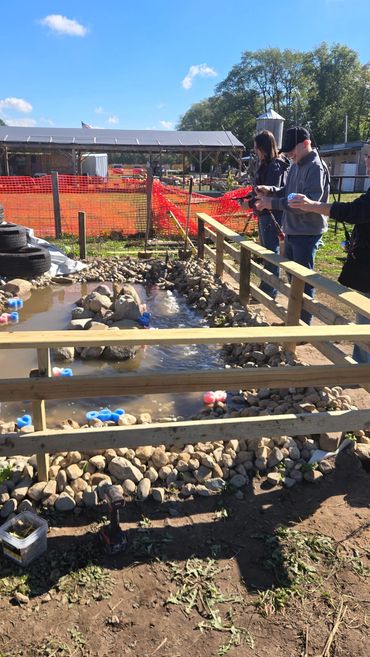 People fishing at the fishing hole in Mishawaka.