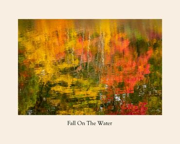 Colorful fall foliage reflected in rippling water.