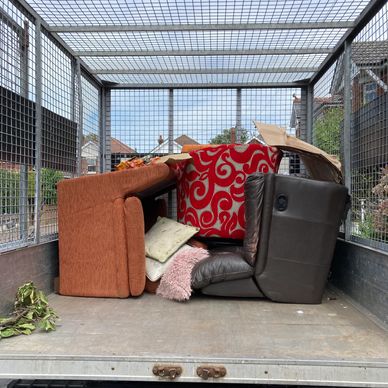 Sofas in Rubbish Truck