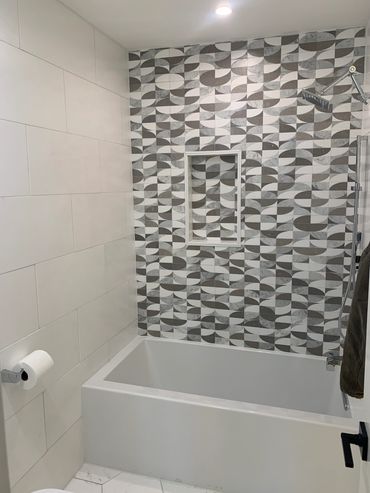 full quartz tile installs in a bathroom remodel