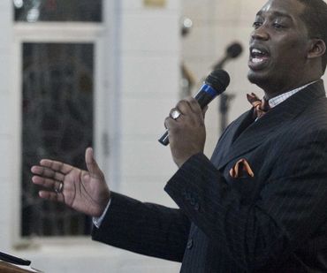 Reverend Dr. Robert Augustus Jackson, Jr. speaks during a vigil to end gun violence in 2018.