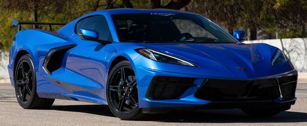 Blue sports car parked outdoors.