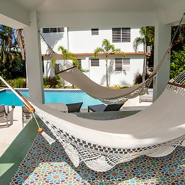 The apartment at R Casa with 2 bedrooms, 2 bathrooms and a shared pool and lounge area with hammocks