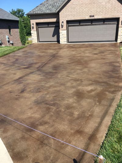 Concrete stain application on driveway