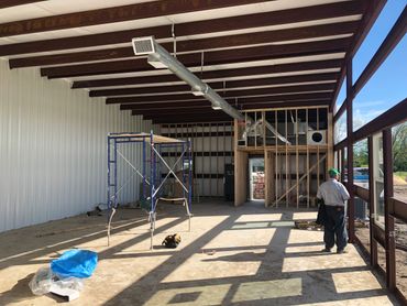 The inside of a metal building currently in construction.