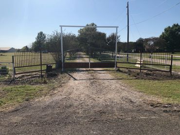 A picture of a completed metal gate for a driveway.