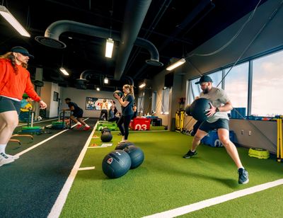 Coach leading a group strength and conditioning class at Dynamix Fitness in Anchorage.