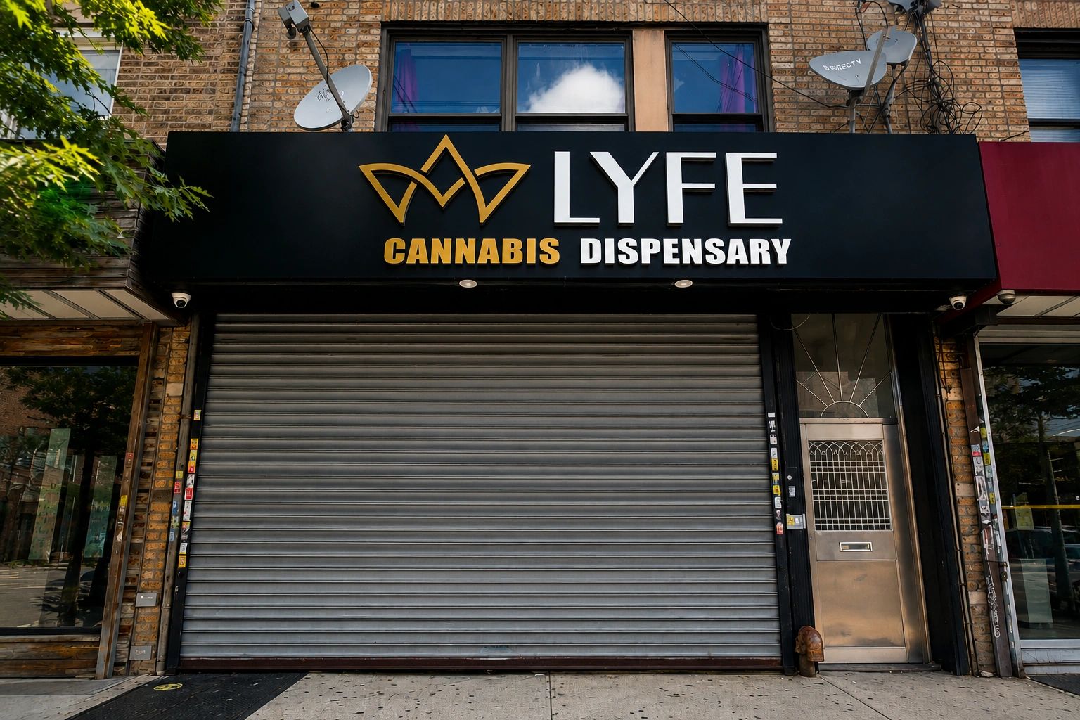 Closed LYFE Cannabis Dispensary storefront with metal shutter.