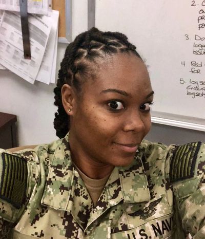 COURTESY OF JACQUALYNN LEAK
Petty Officer 1st Class Jacqualynn Leak hid her locs under a wig
