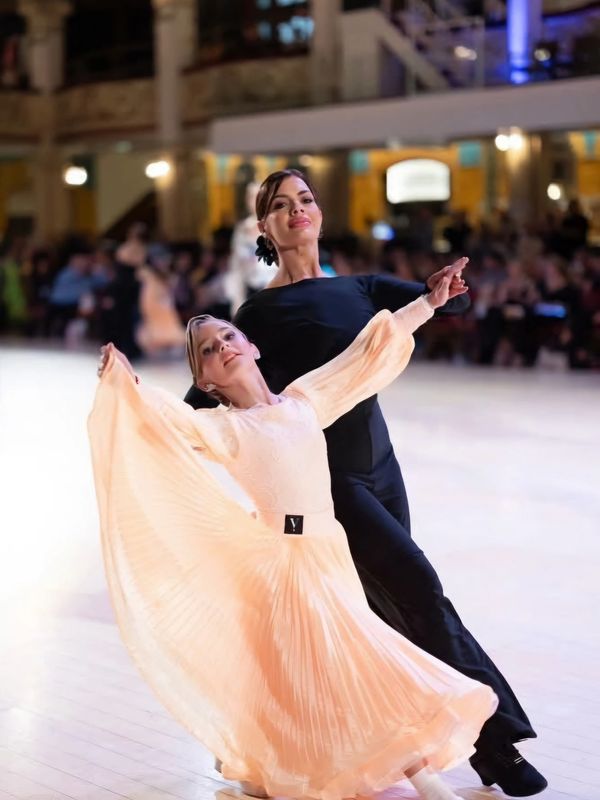 Elegant ballroom dancers in a graceful pose.