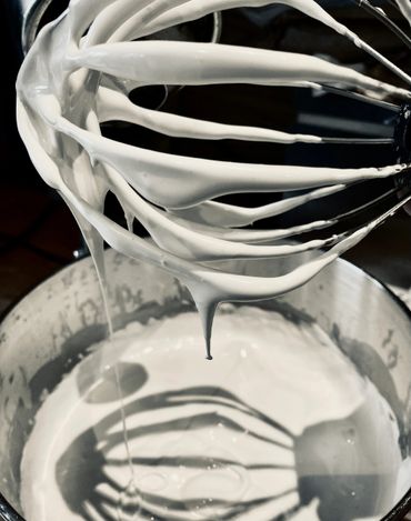 whisk lifted out from the kitchen aid after whisking marshmallow