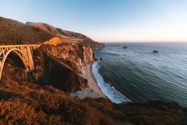 A landscape of the beach coastline and cliffs
