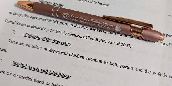 Divorce document with company pen (Legal Peppers) on top.
