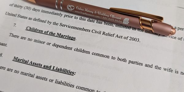 Divorce document with company pen (Legal Peppers) on top.