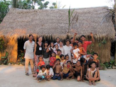 Mr. Leng and the kids of ODA in front of the Palapa Art Gallery they built.     