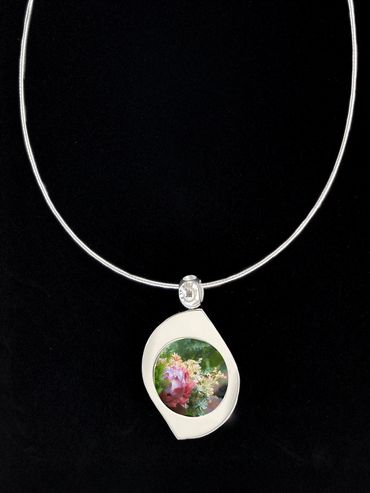 Silver pendant with image of colorful succulent inserted