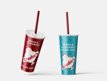 Two colorful Bruster's slushie cups with red straws on a plain background by Kindall Wright - KX Graphic Design.
