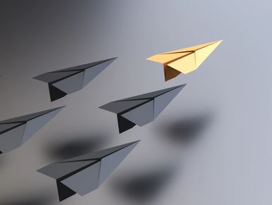 Driving concept, yellow lead plane driving black planes, with empty space on the right side.