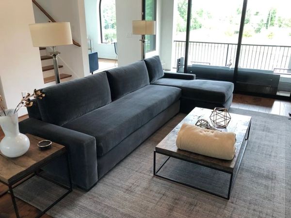 A very expensive blue/gray velvet sectional sofa after having the fabric upholstery cleaned.