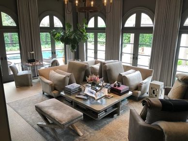 A cream linen sofa sectional in a living room after getting the upholstery cleaned.