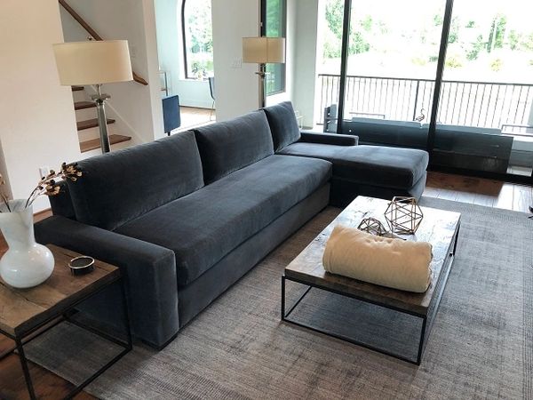 A very expensive blue/gray velvet sectional sofa after having the fabric upholstery cleaned.