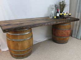 Mobile bar with live edge board and oak barrels 