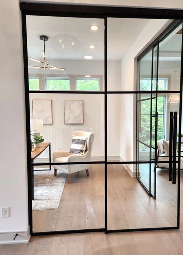 Glass walls that make up a home office space