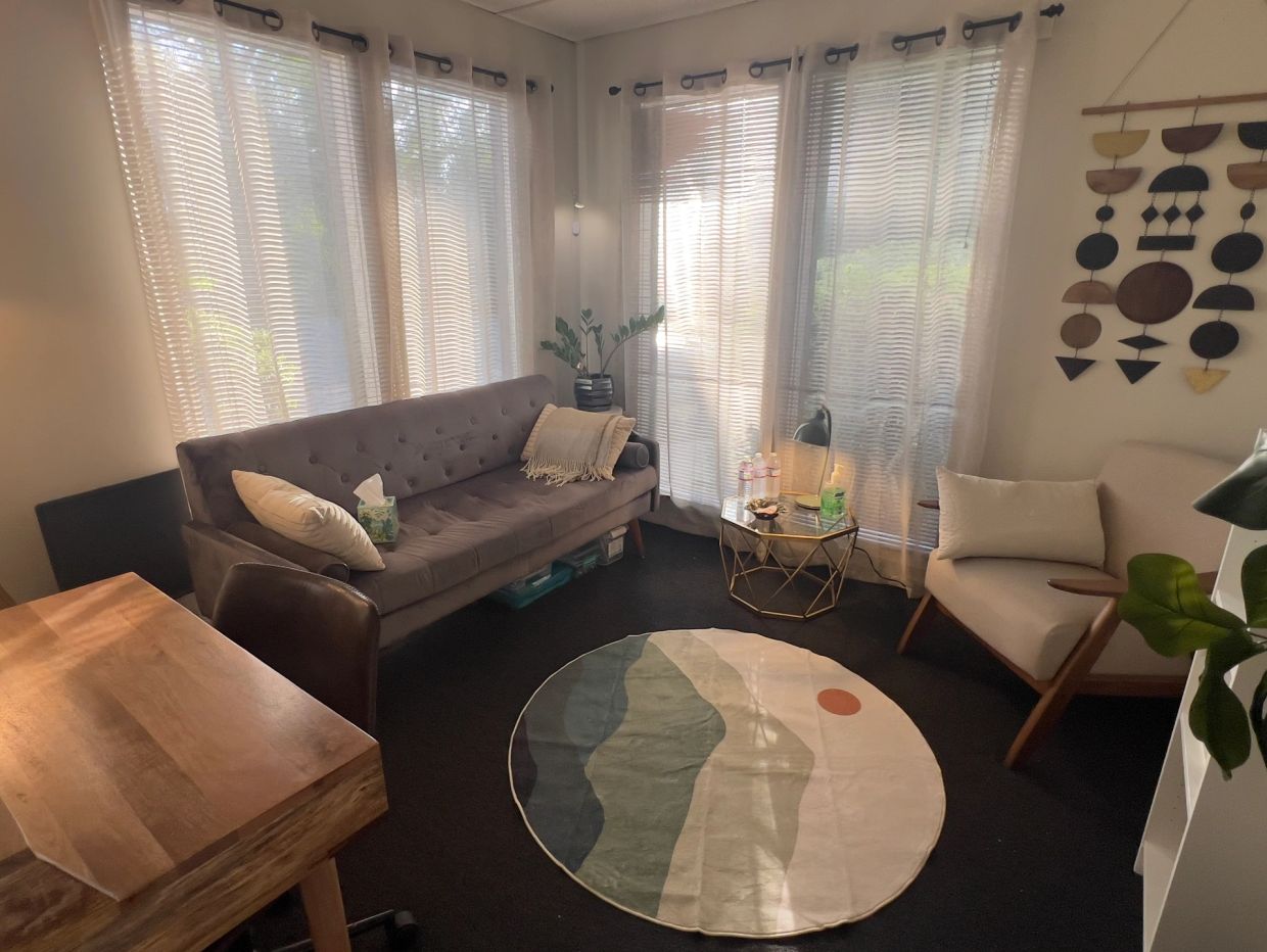 Cozy living room with modern decor and natural light.
