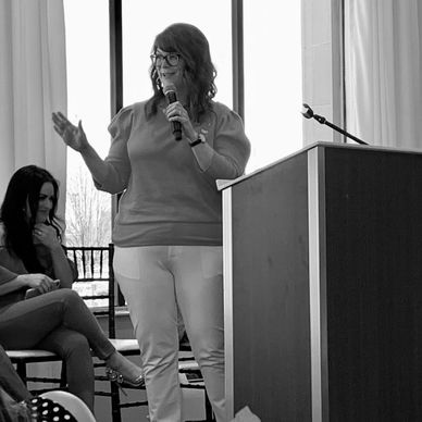 Jessie speaks to the guests at the EmpowHer conference for women.